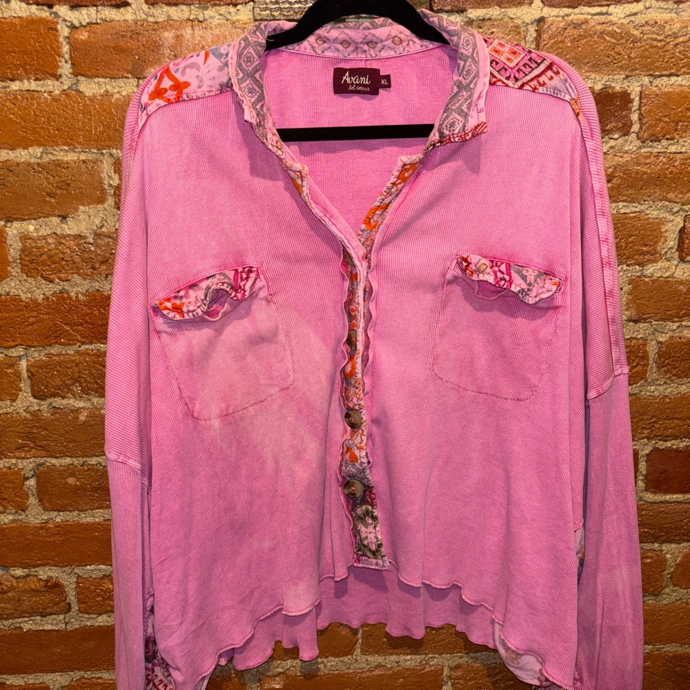 Avani, flown pink and patterned button up top.